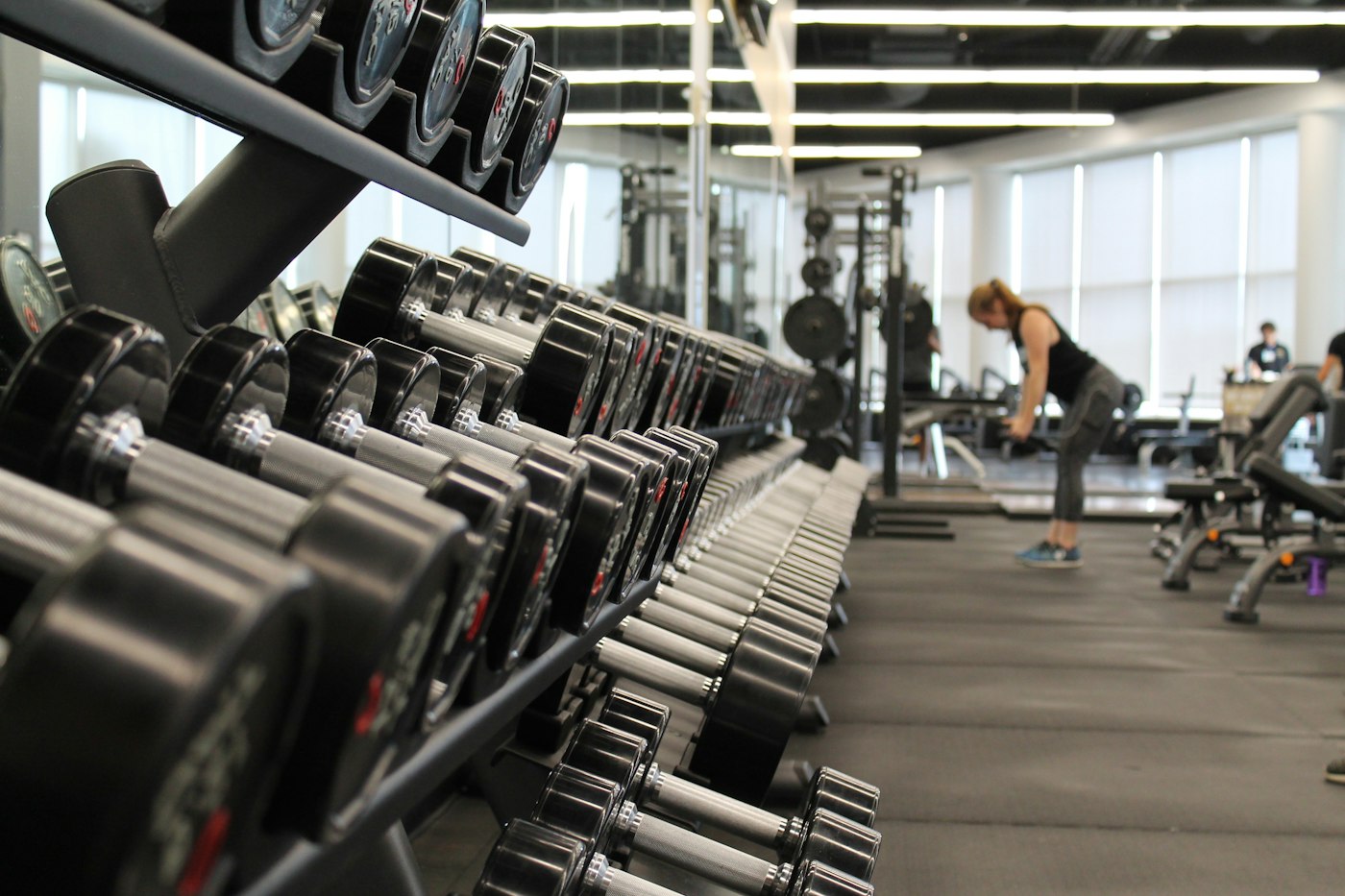 Rack of dumbbells in a bright gym